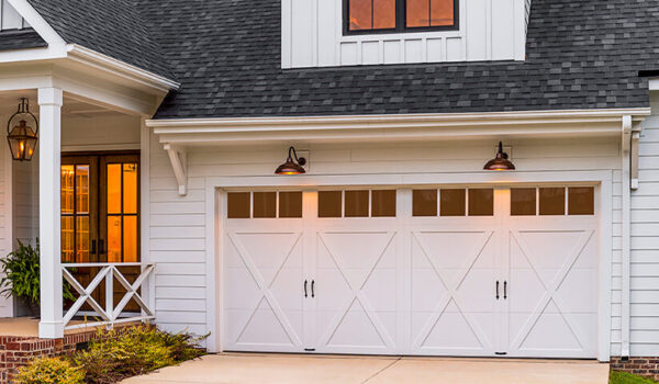 Coachman® Authentic looking insulated steel and composite carriage house garage doors.